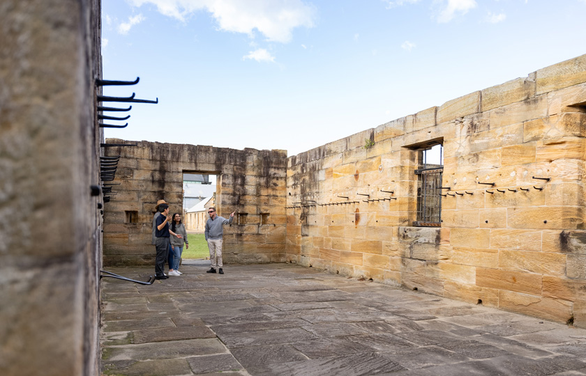 Visitors exploring Cockatoo Island's Convict Precinct while on our Convict Prison Tour.