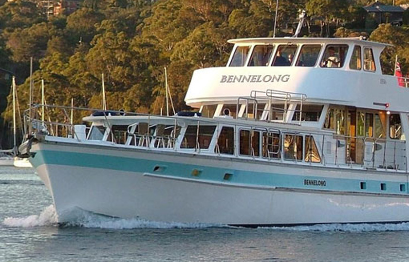 Naval Historical Society of Australia's Bennelong cruise boat on the water in Sydney Harbour.