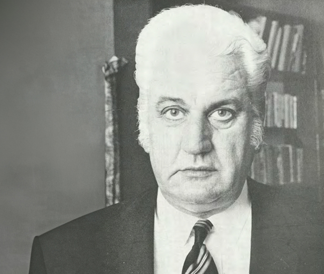 Black and white portrait image of Sir John Kerr in a suit.