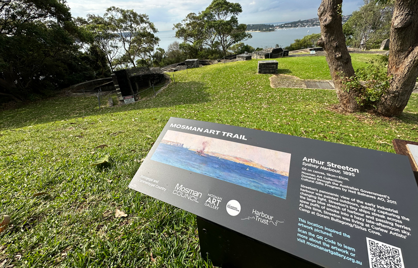 Mosman Art Trail sign with Sydney Harbour in the background at Georges Head Lookout in Headland Park, Mosman.